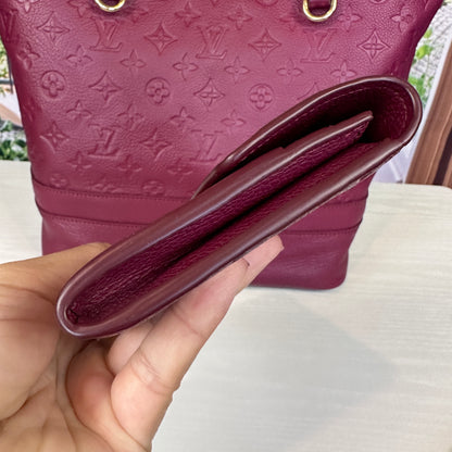 Louis Vuitton Curieuse Wallet Aurore Empreinte Leather